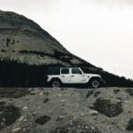 Explore scenic landscapes with a rugged vehicle in Banff's wilderness.