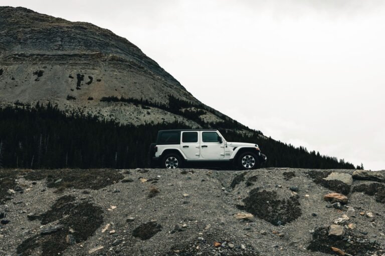 Explore scenic landscapes with a rugged vehicle in Banff's wilderness.