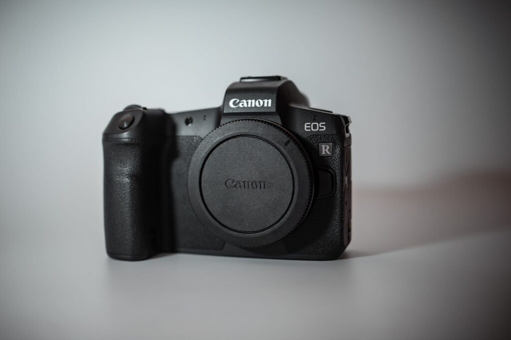 pexels-photo-30550462-30550462-1 Sleek Canon EOS R mirrorless camera with advanced features and compact design.